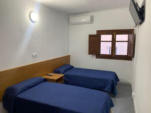 Postel nebo postele na pokoji v ubytování Hotel Playa + 6 fotografií