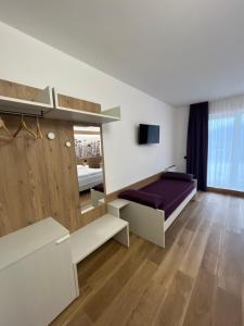 a bedroom with a bed with a purple mattress at Agritur Gasadòr in Trento