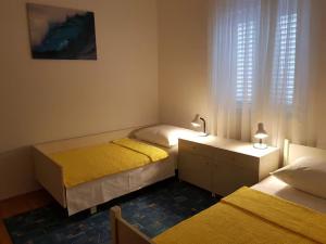 Ένα ή περισσότερα κρεβάτια σε δωμάτιο στο Apartment MiM