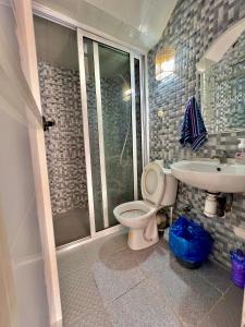 a bathroom with a toilet and a sink at Dar Amzil in Aourir