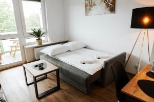 Ένα ή περισσότερα κρεβάτια σε δωμάτιο στο Apartament Jemiołuszki