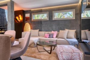 a living room with a couch and chairs and a table at Casita Moritz in Costa Teguise