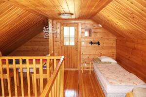 Postel nebo postele na pokoji v ubytování Ounasloma Holiday Cottages