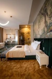 Postel nebo postele na pokoji v ubytování Domeniile Martinutzi -Hotel Cardinal si Conac Rhedey