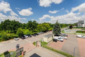 an aerial view of a parking lot at ALE Jerozolimskie Varsovia Apartments in Warsaw