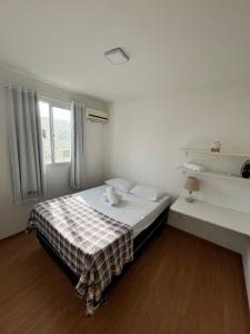 Ένα ή περισσότερα κρεβάτια σε δωμάτιο στο Apartamento Praia de Ponta com dois quartos +34 φωτογραφίες