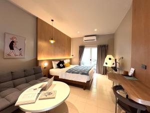 Llit o llits en una habitació de LAZYDAY IN NIMMAN