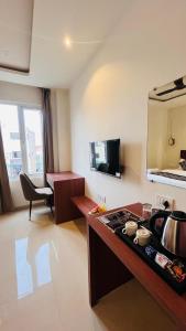 a kitchen with a stove top in a room at THE COMFORT Inn in Faizābād