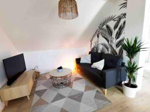 Posezení v ubytování appartement deux chambres avec balcon et petite terrasse