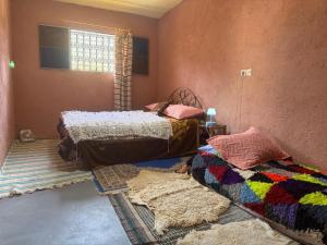 Postel nebo postele na pokoji v ubytování Gite Amani Guest House + 41 fotografií