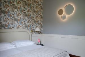 Voodi või voodid majutusasutuse Grand Hotel Panoramic toas