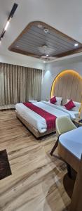 Postel nebo postele na pokoji v ubytování Hotel Prince Stays