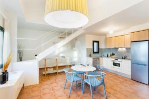 a kitchen and dining room with a table and chairs at Begur Sunset 2 bedroom loft close to the center of Begur. With terrace and gorgeous sea views H42 in Begur