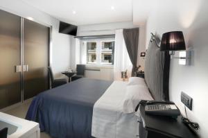 Postel nebo postele na pokoji v ubytování Barbarella Suite