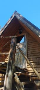 an open door of an old wooden building at Merelahe in Koolimäe +5 photos