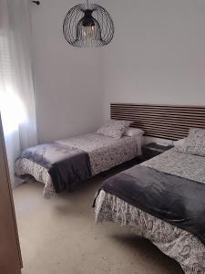 Voodi või voodid majutusasutuse Piso céntrico en Moguer toas