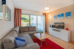 Μια τηλεόραση ή/και κέντρο ψυχαγωγίας στο Apartment Seemöwe