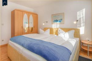 Ένα ή περισσότερα κρεβάτια σε δωμάτιο στο Apartment Seemöwe