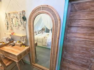 A bed or beds in a room at Secret Triangle