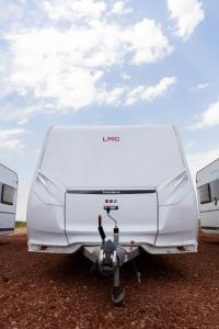 a white camper van parked in a dirt field at On Wheels by Yerra in Yervandashat +5 photos