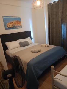 a bedroom with a bed with two pillows on it at Mediterrianen paradise in Kaštela