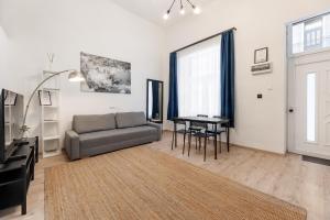 Posezení v ubytování Downtown Suite + 2 fotografie