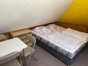 Postel nebo postele na pokoji v ubytování Apartmány Jedovnice