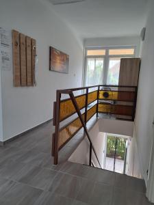 a room with a staircase with a bunk bed at Napsugár apartman Balatonboglár in Balatonboglár