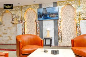 Televisyen dan/atau pusat hiburan di Giza Inn view