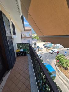 a balcony of a house with a view of a street at A casa di Matilde in Terzigno
