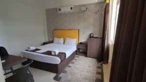 Ένα ή περισσότερα κρεβάτια σε δωμάτιο στο Hotel Mild Inn