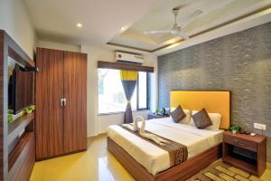 Ένα ή περισσότερα κρεβάτια σε δωμάτιο στο Hotel Mild Inn