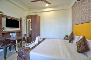 Ένα ή περισσότερα κρεβάτια σε δωμάτιο στο Hotel Mild Inn