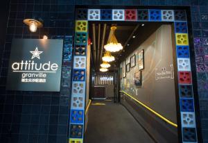 a hallway in an office with a sign on the wall at attitude on granville in Hong Kong