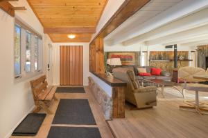 a living room with a couch and a table at 45 Idlewild in Winter Park