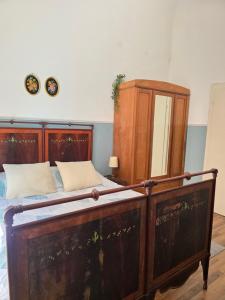 Voodi või voodid majutusasutuse Borghese Rooms - Città Vecchia Locarno toas