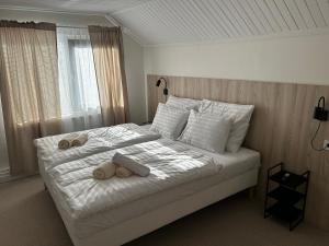 Postel nebo postele na pokoji v ubytování Hotel Sport Houštka + 76 fotografií