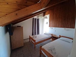 Postel nebo postele na pokoji v ubytování Tassos & Marios Apartments I