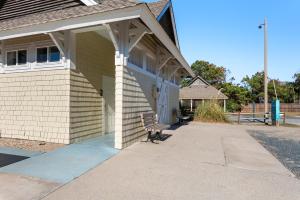 a building with a bench in front of it at Live Oak Landing in Corolla