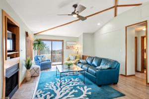 a living room with a couch and a table at 3 Weeks On The Shores in Southern Shores