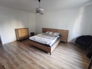 En eller flere senge i et værelse på Zagan Apartments #2