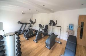 a gym with several exercise bikes in a room at House 29 in Looe