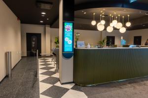 a bar in a lobby with a counter at Ring SPA Hostel in Tallinn +42 photos