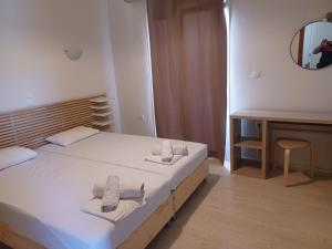Postel nebo postele na pokoji v ubytování Tassos & Marios Apartments I
