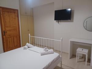 Postel nebo postele na pokoji v ubytování Tassos & Marios Apartments I