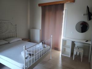 Postel nebo postele na pokoji v ubytování Tassos & Marios Apartments I
