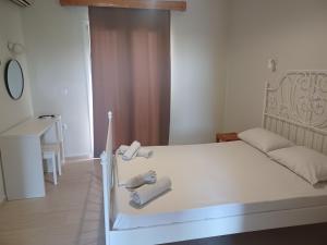 Postel nebo postele na pokoji v ubytování Tassos & Marios Apartments I