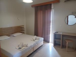 Postel nebo postele na pokoji v ubytování Tassos & Marios Apartments I