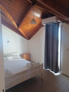 Postel nebo postele na pokoji v ubytování Tassos & Marios Apartments I