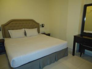 מיטה או מיטות בחדר ב-Executive Residence